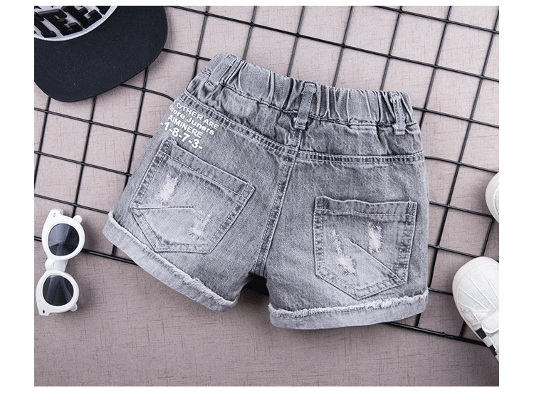 Quần short denim cho bé trai mùa hè 2019 quần trẻ em mới quần giữa mùa hè bé trai mỏng rách quần nóng 2915 - Quần jean