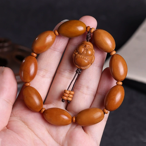 Браслет натурального оливкового ядра разворачивает световые бусинки Qiankun.