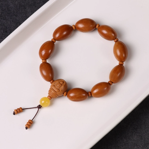 Браслет натурального оливкового ядра разворачивает световые бусинки Qiankun.