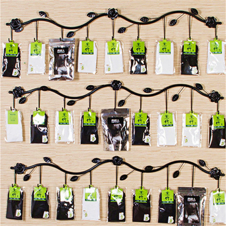Wrought iron clothing store hanger socks shelf boxed children's stockings stockings stockings display rack wall hook wall hanging