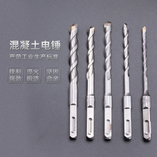 Распространите удар с электрическим молотком через стену, две ямы, две слоты, круглую ручку, четыре ямы, квадратная ручка бетонной цементной стены алмаз