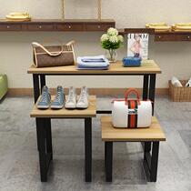 Shopping mall clothing store display stand Zhongdao running water table high and low table window shoe bag display cabinet flower stand customization