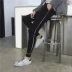 Mùa xuân co giãn Quần bó sát nam Phiên bản Hàn Quốc của xu hướng quần Harlan chân trẻ trung quần âu Quần lửng nam
