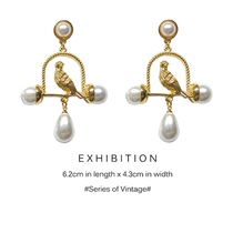 Exaggerated retro French niche design metal birdcage Pearl Palace style super Fairy earrings ear clip earrings ear clip without ear hole female