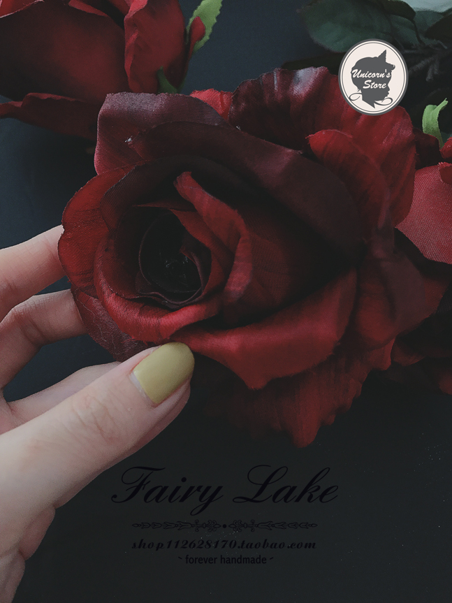 vintage gucci retro style dark red wine rose emulation flower women's clothes shop decorated with photographic props