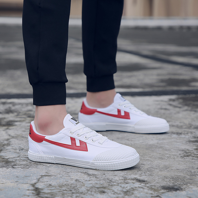 Warrior pull back football shoes male and female students artificial grass training shoes breathable canvas soft bottom TF broken spikes