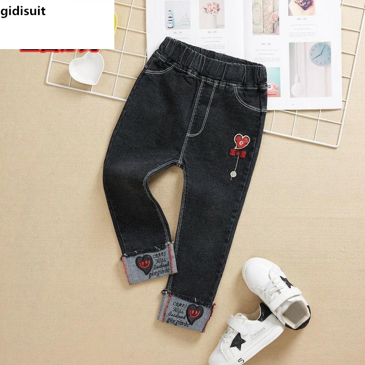 quần trẻ em mùa xuân và mùa thu cô gái mới quần jeans denim bùng quần nữ bé giản dị quần dài.