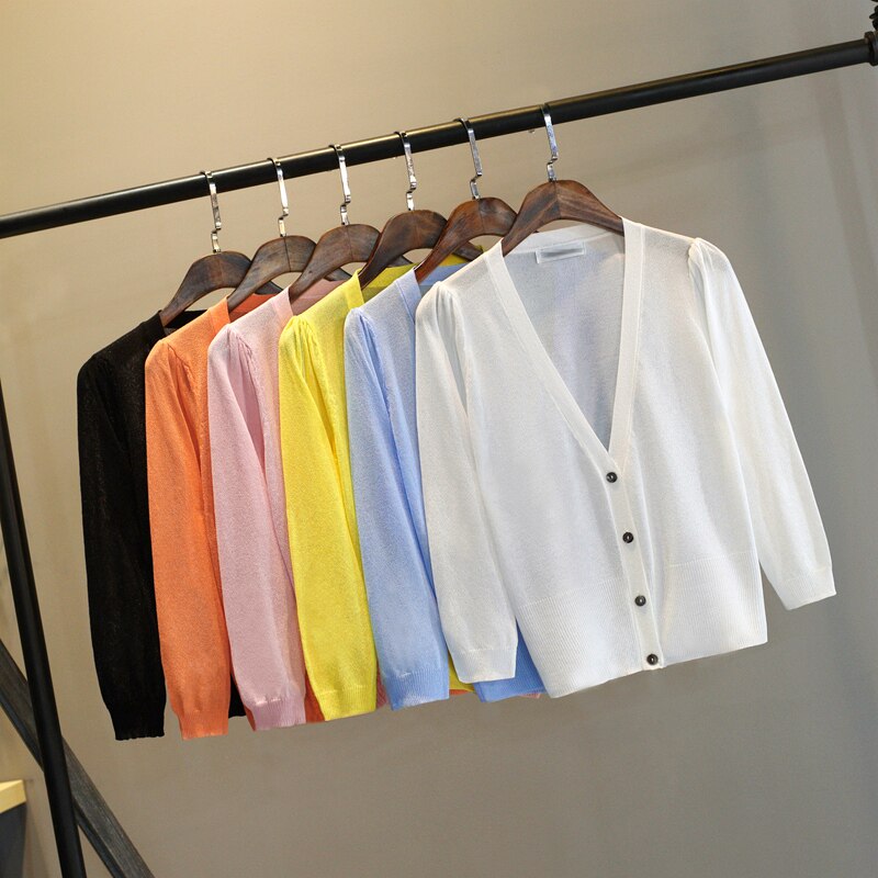 Summer new women's clothing Korean version of candy three-quarter-sleeved knitted sweater blouse short section cardigan air-conditioning shirt sunscreen shirt thin section