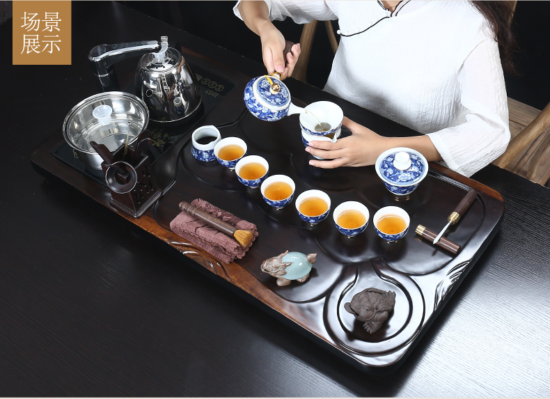 Really hold a complete set of ebony suit household kung fu tea tray tea sets tea cup tea tea kettle automatically