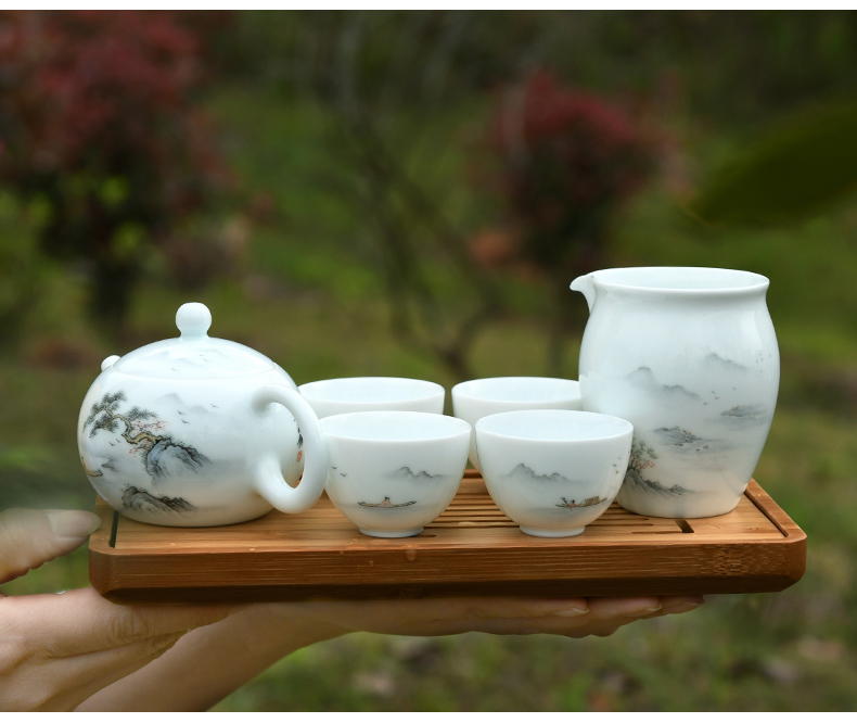 Xu ink white porcelain hand - made travel kung fu tea set household contracted a pot of four cups of tea cup set mini portable package