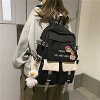 Черный человек белый (с значками и маленькими подвесками из белой утки)