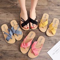 Summer new fashion all-round wear flat shoes simple and comfortable womens slippers solid color thin belt knotted beach cool drag