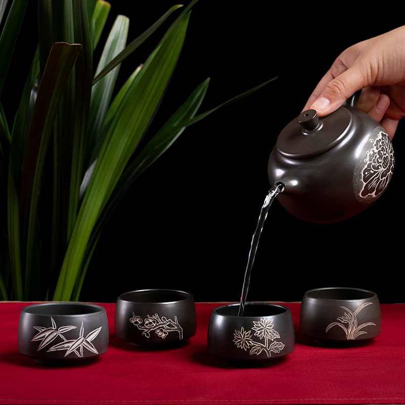 Guangxi Qinzhou nixing pottery pure handmade de clock a pot of four cups of plum orchid bamboo chrysanthemum carved teapot teapot teacup gift box set