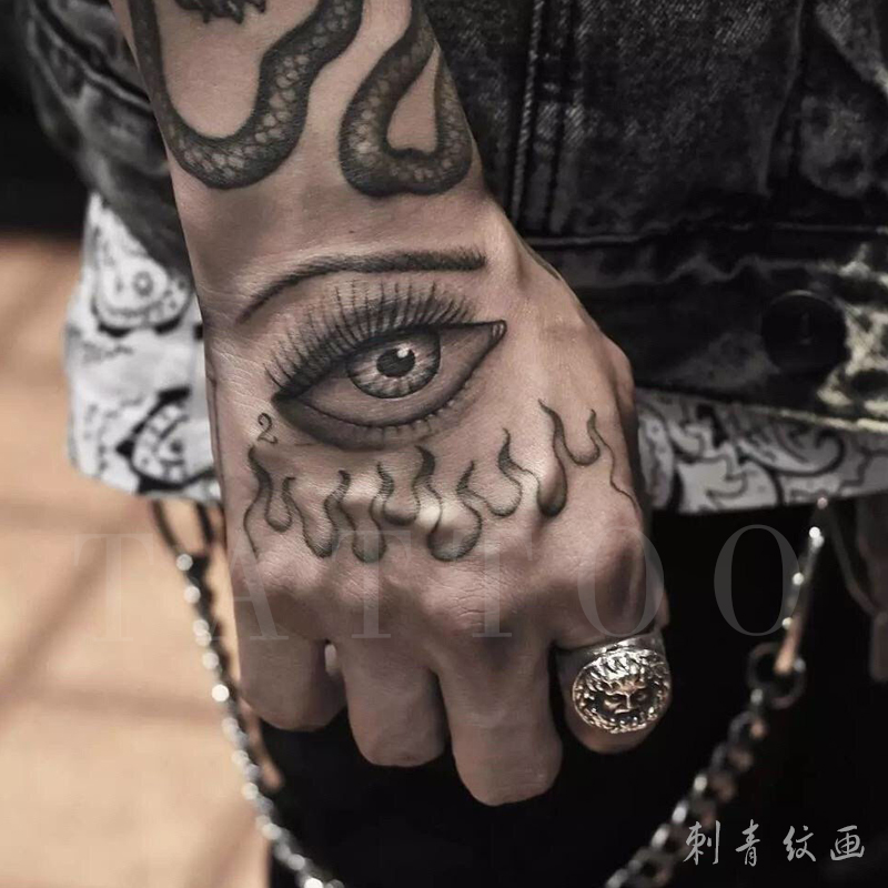 Tattoo stickers flame eyes tattoo original black and white realistic men's trendy European and American style dark series 2022 net red models on the back of the hand