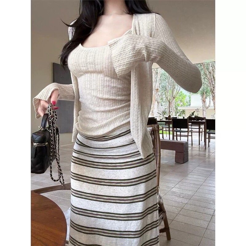 Lazy Striped Knit Skirt + Hollow-Out Ribbed Knit Cardigan Jacket Women's New Style Camisole Three-Piece Set Lazy Striped Knit Skirt + Hollow-Out Ribbed Knit Cardigan Jacket Women's New Style Camisole Three-Piece Set