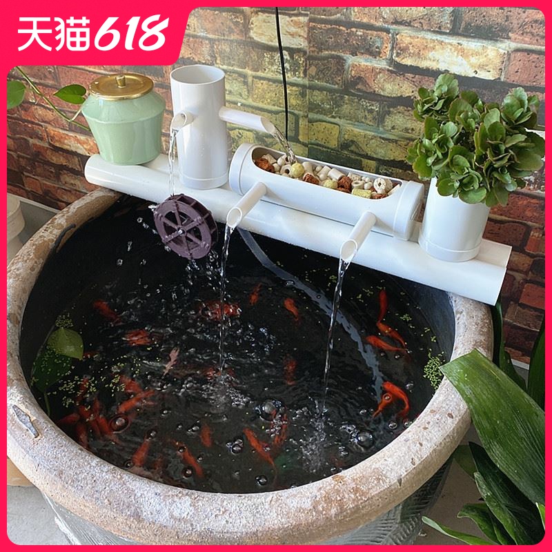 Aquarium filter water circulating water device placed on porcelain jar into which the circular cylinder - oxygen fish small filter pump