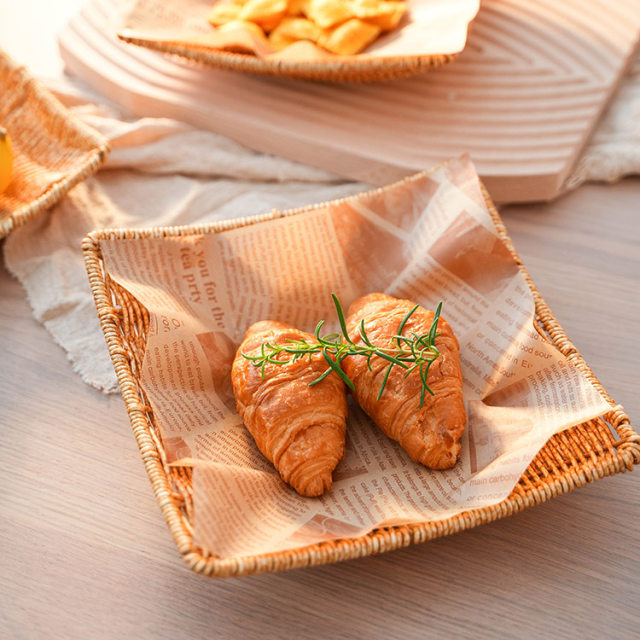 It is a plastic Japanese square snack plate with dessert melon seeds