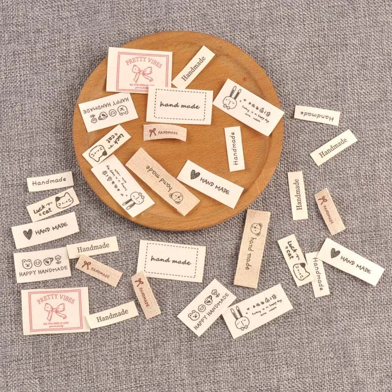 DIY用ベージュの衣類ラベル、衣類タグ、折り畳み布パッチ（50個入り）