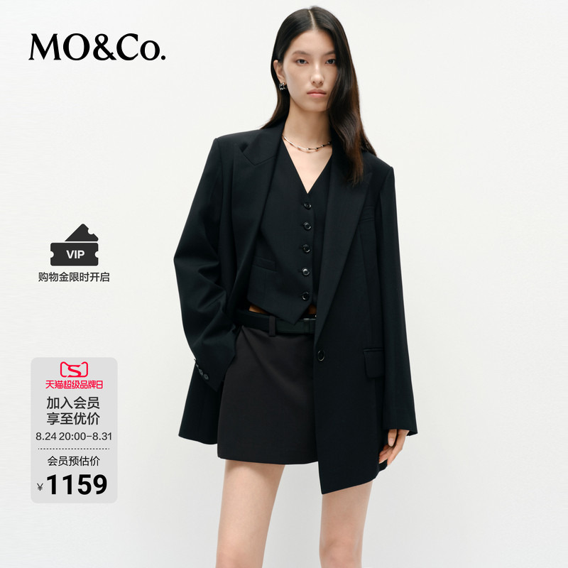 Moco Suit with Stretch Merino Wool, Fashionable Shoulder Pads, Low Waistline, Boxy Fit Silhouette, Power Coat by Mo&Co Moco Suit with Stretch Merino Wool, Fashionable Shoulder Pads, Low Waistline, Boxy Fit Silhouette, Power Coat by Mo&Co