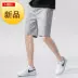 Quần short thể thao nam mới quần nam xu hướng quần cotton năm điểm quần short giản dị nam mùa hè đi biển lỏng lẻo - Quần bãi biển