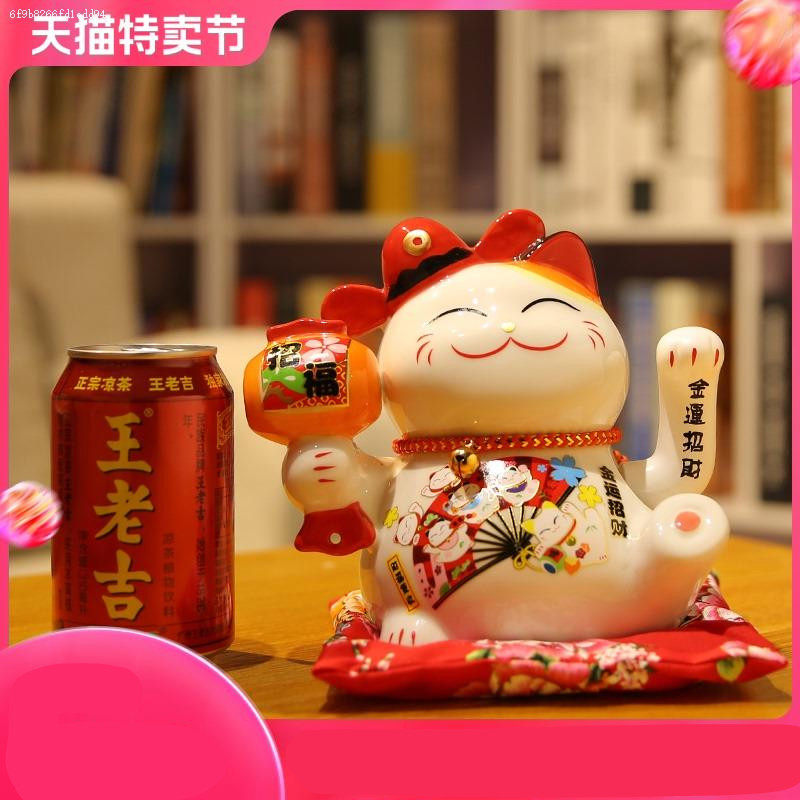 Thirty years old with the same Japanese lucky cat electric shaking hand ornaments opening gift shop cash register counter Home living room