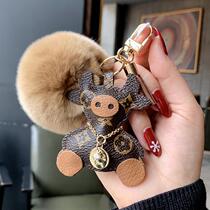 LVGEDETE Mavericks doll car keychain pendant French bucket bag couple pendant fur ball key chain female