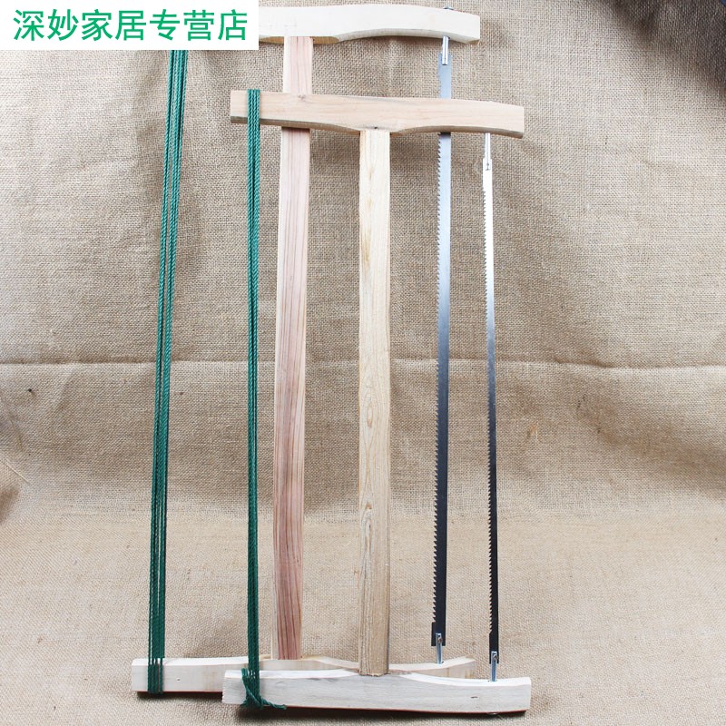 Old-fashioned traditional carpenter saw cutting Bird Saw Manual saw narrow saw blade large frame saw