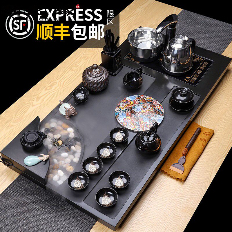 The whole piece of black stone tea tray Kung Fu tea set set household simple automatic color changing atomized flowing water tea table living room