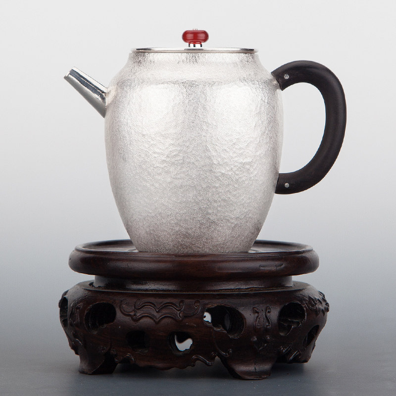 Hammered silver 999 teapot home Yunnan pure handmade silver pot heat insulation handle Japanese kung fu foot silver tea set