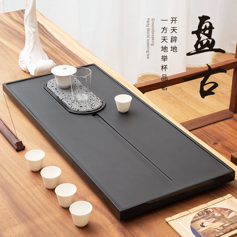 Natural whole black gold stone tea tray household stone drainage tea table simple creative size tea sea tea tray