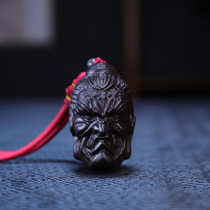 Between the ebony wood carving hand-held pieces of Buddhas head Buddha magic wood car pendant carving crafts play