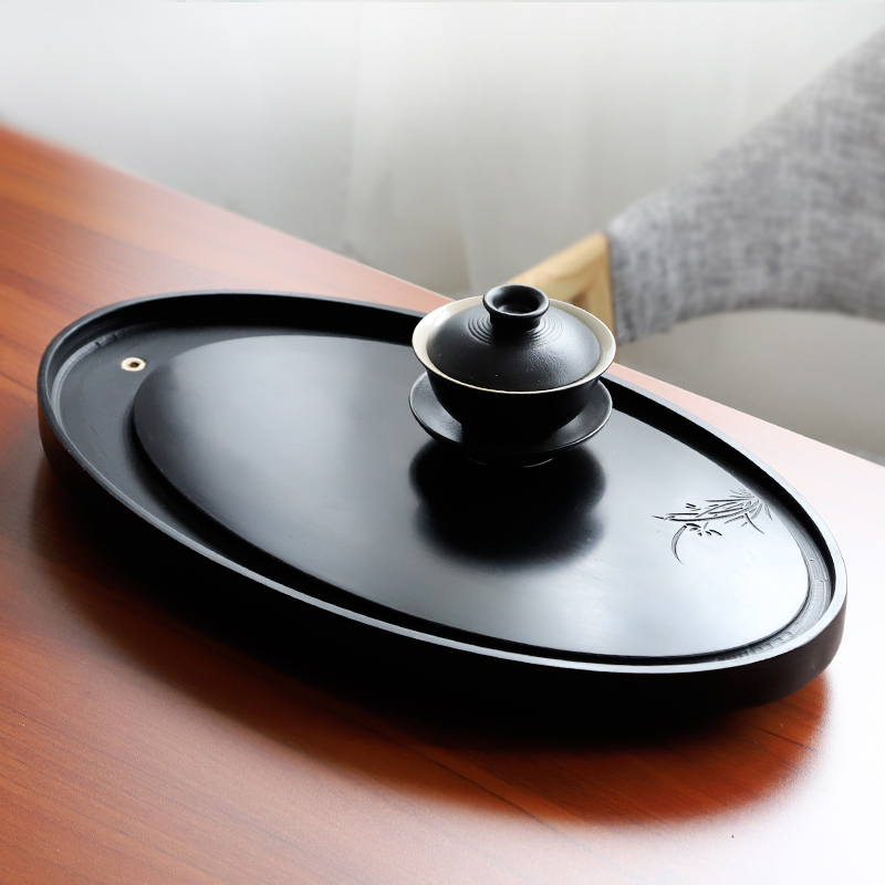 Natural whole black gold stone tea tray Household set Simple dry bubble tray Black Pottery Kung Fu tea tray Drainage tea table