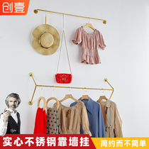 Clothing store solid stainless steel display stand titanium gold hanging clothes against the wall hanging clothes hanging side hanging clothes pole customization
