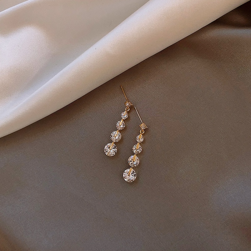 Bright zirconite earrings female streamlined face thin stream stream Su needle simple temperament Korean ear crash pure silver ear needle