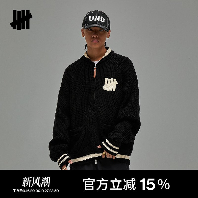 Undefeated Five-Stripe Official Autumn Cardigan with a Ribbed Collar and Sporty Design Elements Undefeated Five-Stripe Official Autumn Cardigan with a Ribbed Collar and Sporty Design Elements
