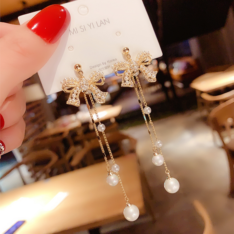 Korean temperament comeback butterfly knot pearl earrings French style net red long version Stream sueared with a thin ear-pin female