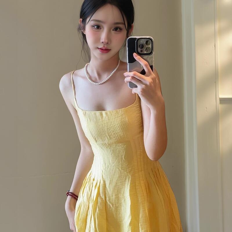 Artistic Student Wears a Bright Yellow Spaghetti Strap Dress for Women in Summer, Waist-Cinching, Slimming A-Line Dress, Long Dress for Seaside Vacation