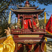 The gods sedan chair the sedan chair parade through the streets the raised eaves the Buddhas niche the tribute platform the God of Wealths shrine
