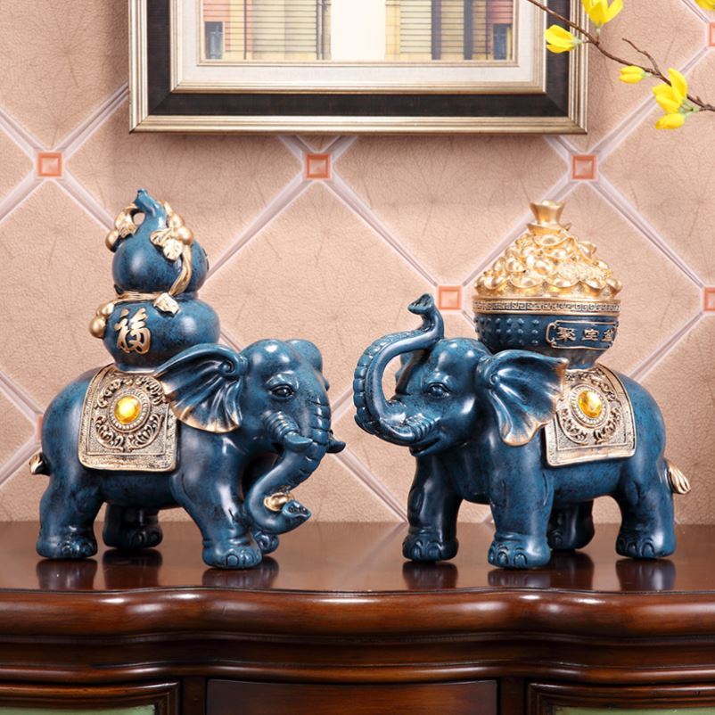 A collection of financial and elephant tricks a couple sucks up the property and white jade stone sculptures an elephant pair look at the door town mansion Sculpture Feng Shui Elephant