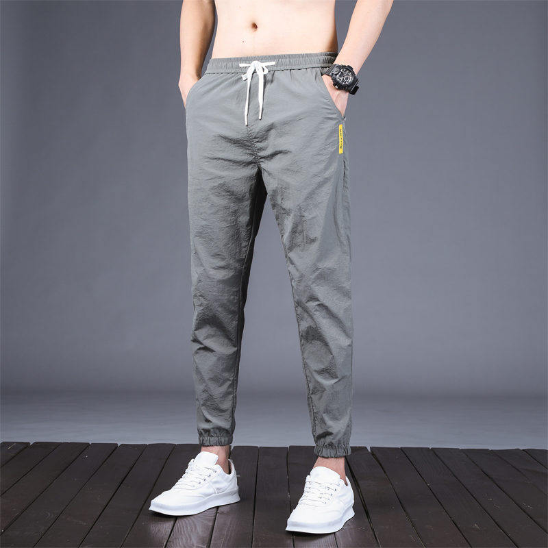 Summer Thin men's Korean version Trend casual pants 100 hitch Icing Silk Loose Bunch Foot Sports Tooling Pants Air Conditioning Pants