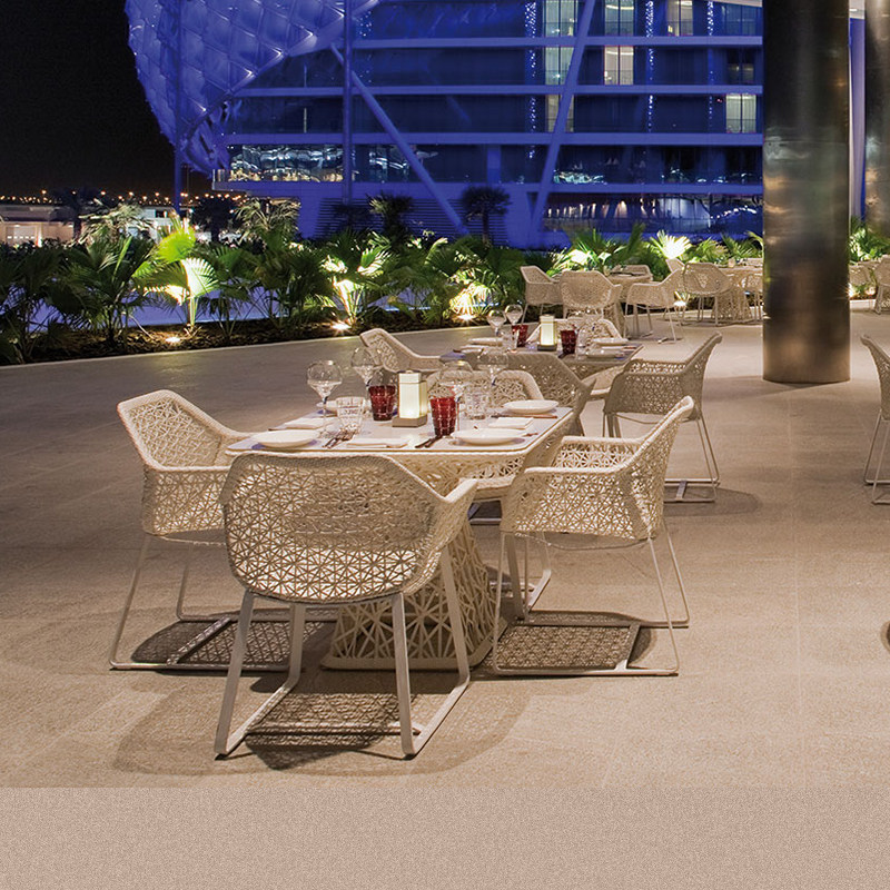 Outdoor table and chair designer balcony hotel villa simple rattan aluminum alloy outdoor leisure rattan chair creative combination