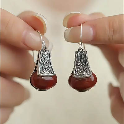925 Silver Tang Grass-patterned Red Agate Egg Face Earrings, a new Chinese-style retro, niche, artistic, light luxury and high-end earpiece for women