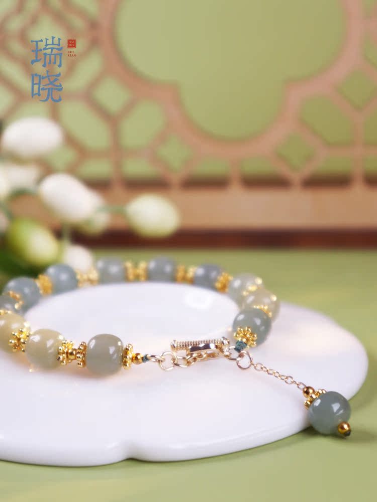 Ruixiao four-leaf flower natural Hetian jade sapphire bracelet female models s925 sterling silver Qingshui transfer bead bracelet birthday gift