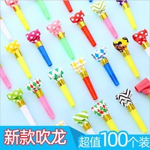 Toy children toy with mouth blown with a smile on the face and blow the whistle on the creative whistleblowing toy birthday party booing.