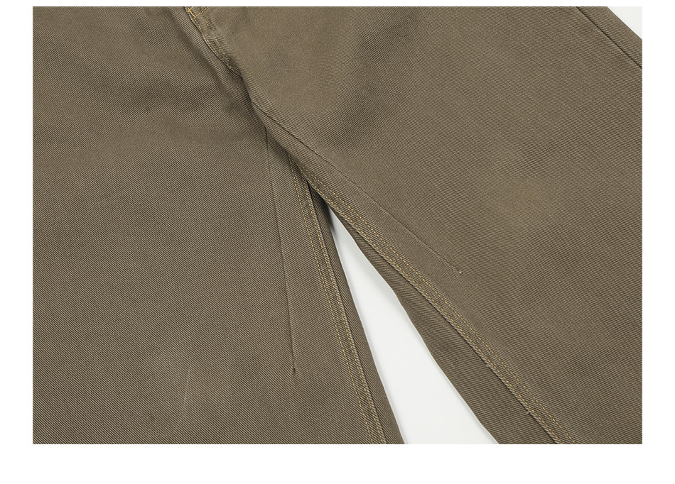 Close-up of EastLyst’s Retro Distressed Flare Pants features a seam and long fabric slit, emphasizing the textured material and detailed stitching.