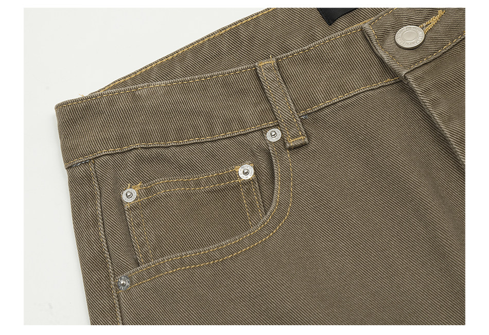 Close-up of the front pocket on EastLyst’s Retro Distressed Flare Pants from the 2025 summer collection, featuring detailed stitching, coin pocket, rivets, belt loop, and metal button on these vintage-washed jeans.
