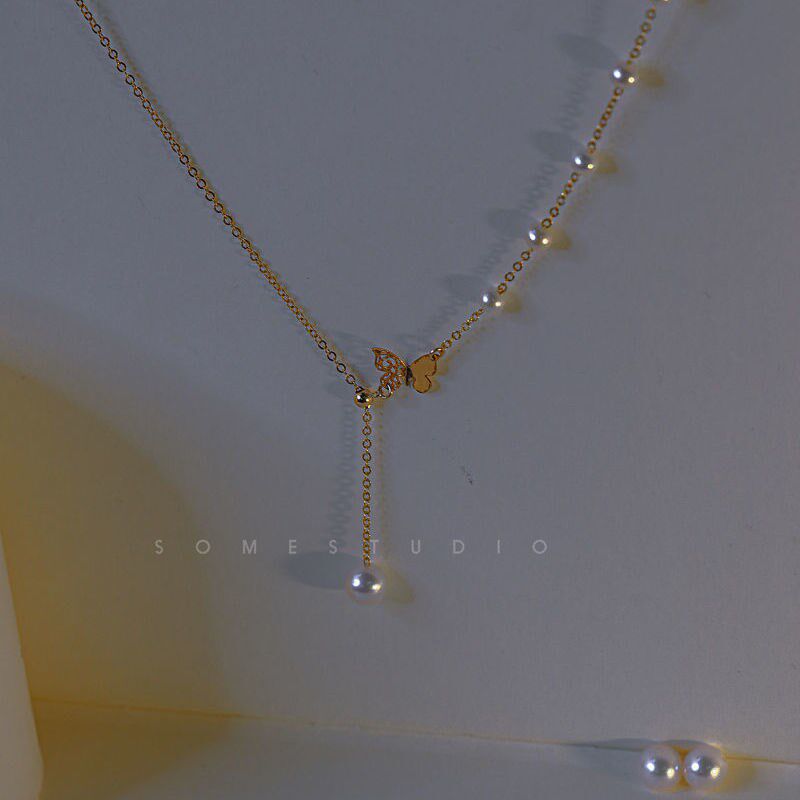 Necklace 2021 New female butterfly knot Y-word pearl refined collarbone chain light lavish, lukewarm wind retro