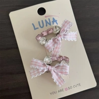 Розовый клетчатый овальный ромбовидный узел