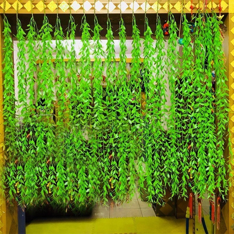 Decorative green flowers and grass strips plastic fake leaves green simulation leaves fake winding strips vines green leaves background wall plants