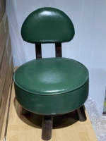 Полностью зеленый кожаный стул, модель, вращающаяся на 360 градусов.